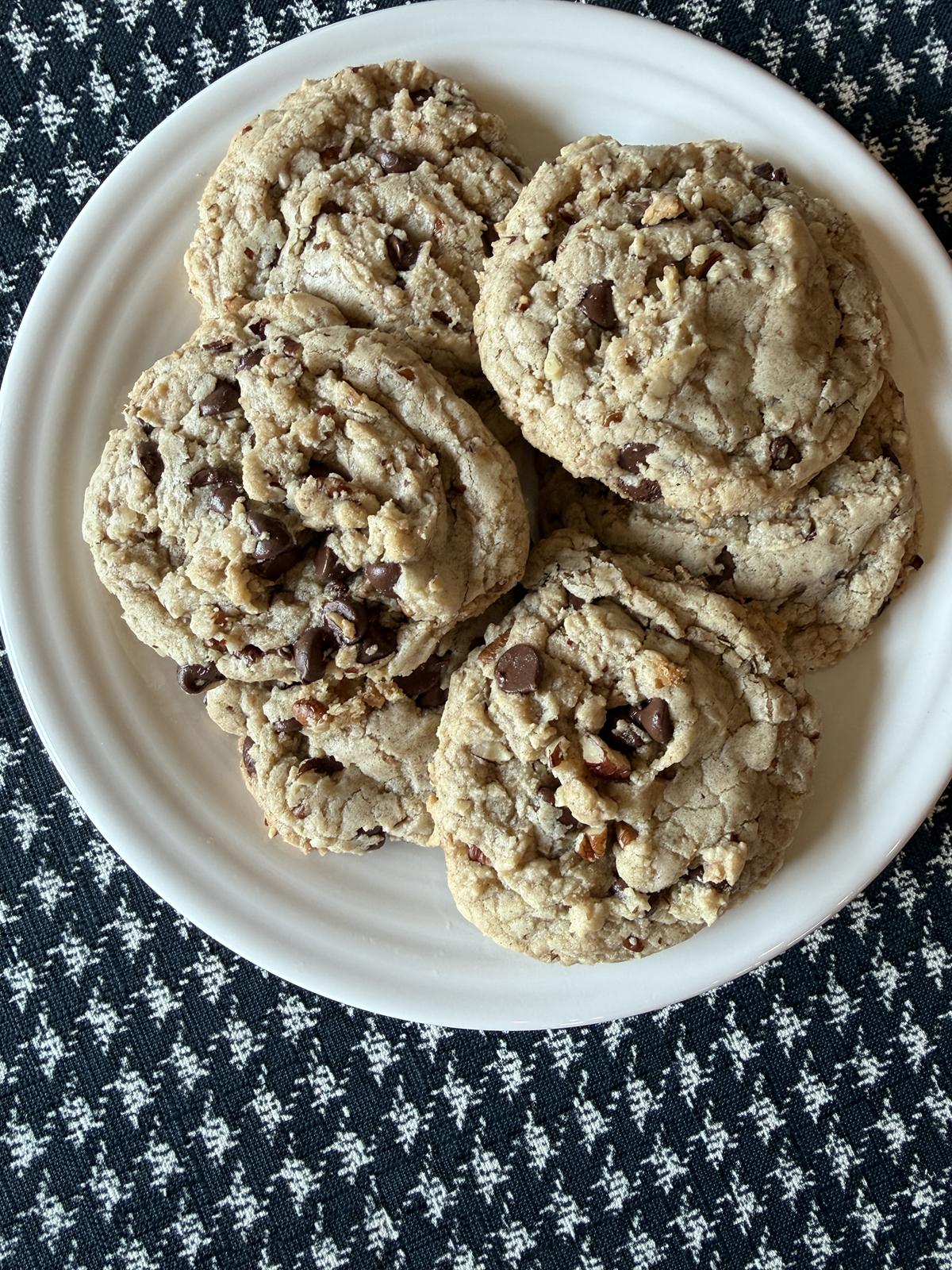 gluten free chocolate toffee pecan cookies on white plate